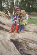 Children on fallen beech, Peter Wakely/English Nature